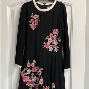 modest black dress with embroidered flowers
